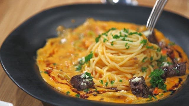 Plate of rose pasta with chuck flap tail