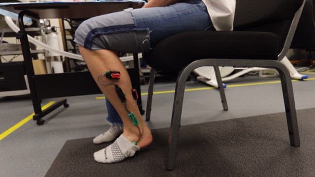 Legs of a person doing a soleus exercise