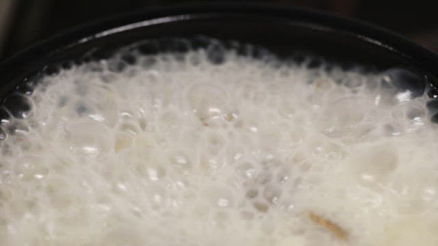 Boiling broth in a pot