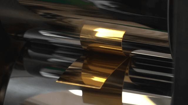 Metallic rollers processing golden foil