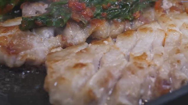 Grilling pork belly with kimchi on a hot pan