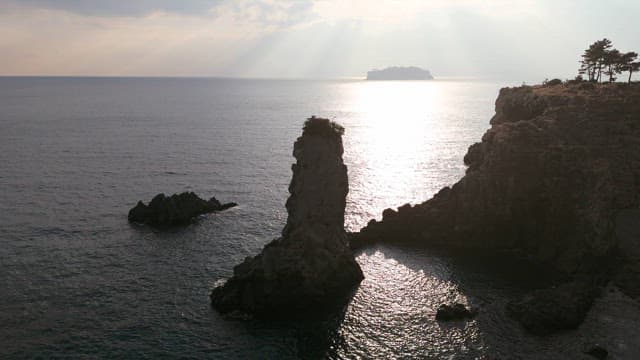 Rocky coastline by the sea with sunlight
