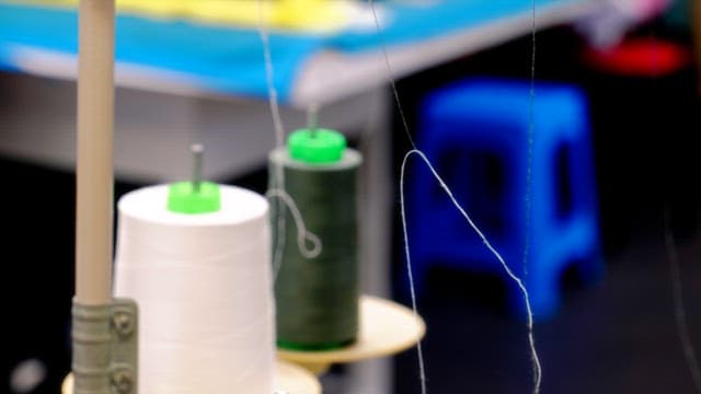 White and green threads prepared for sewing