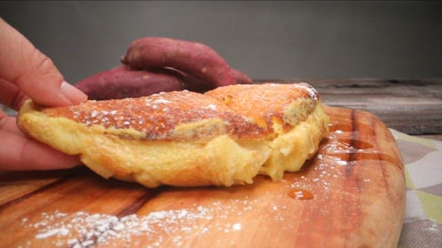 Sweet potato soufflé pancake on a wooden board