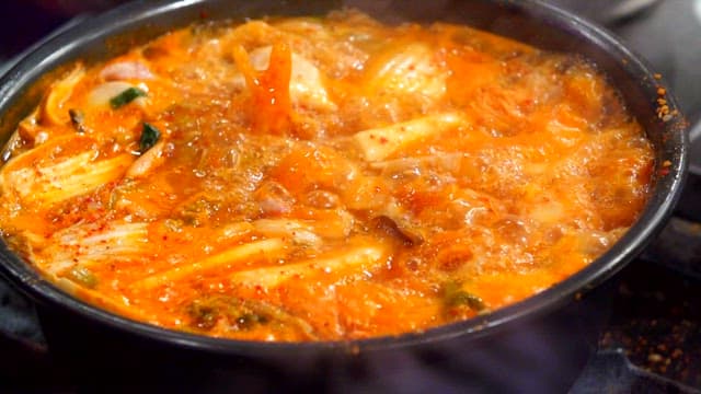 Boiling spicy chicken hotpot and noodle soup with chicken