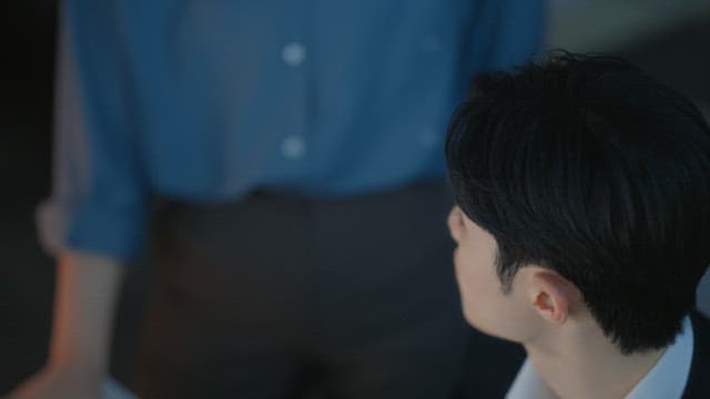 Man in a suit working at a desk