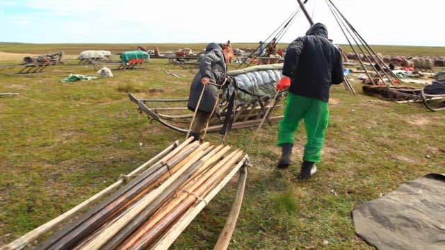 Nomads Carrying Poles on Sledges