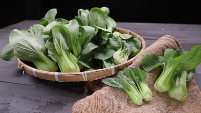 Fresh bok choy on a wooden table
