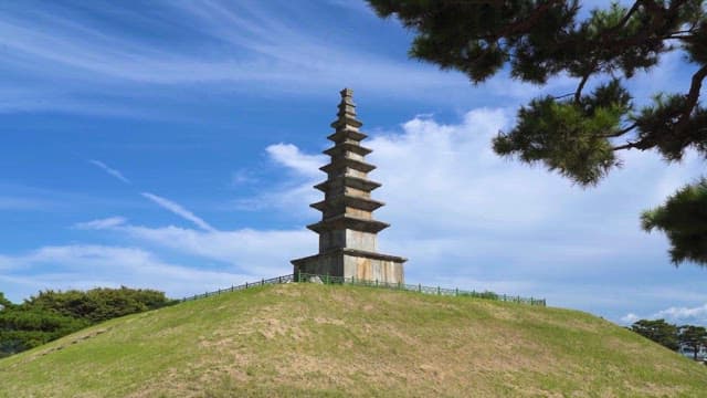 Ancient Pagoda on a Grassy Hill