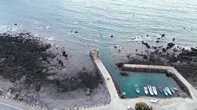 Rocky coastline with a small pier