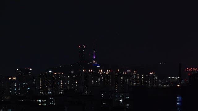Fireworks over a city skyline at night