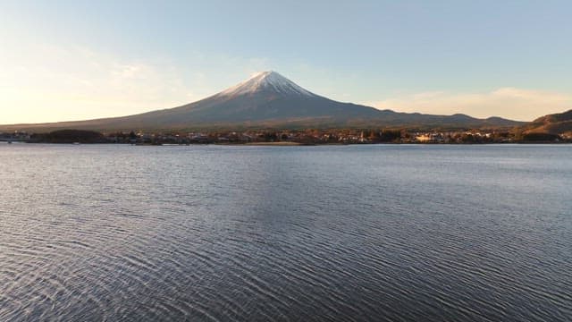 Serene lake with a distant Mount Fuji