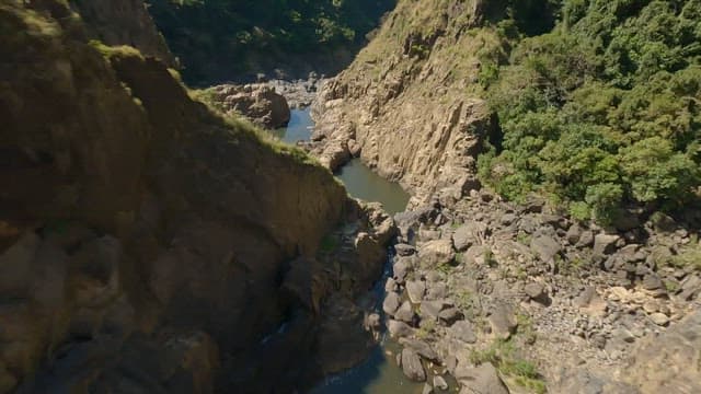Mountain range with rocky canyons and lush forests
