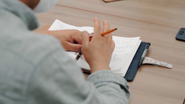 Person who Notes Important Details in a Diary