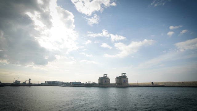 View of the dock with industrial tanks