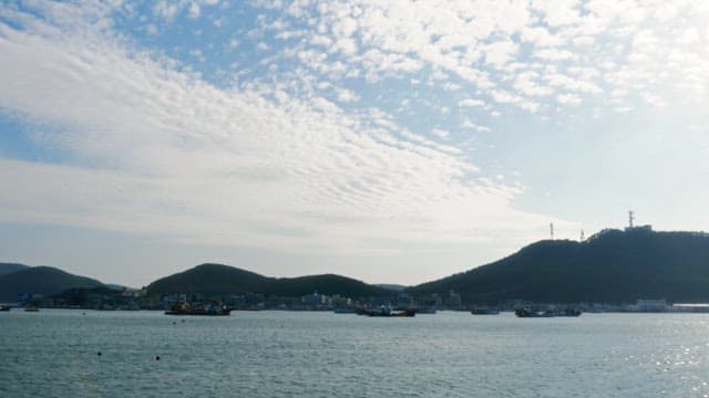 Clouds spread over the sea with many fishing boats