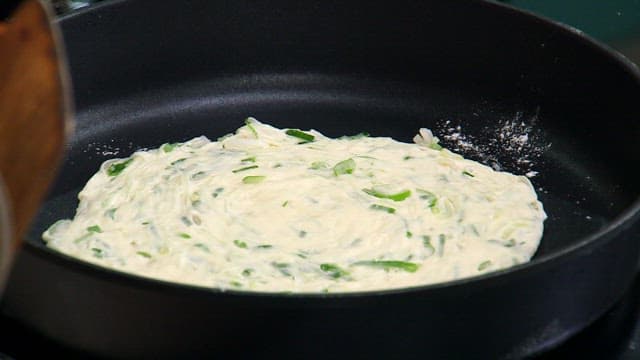 Korean green onion pancake batter in a pan