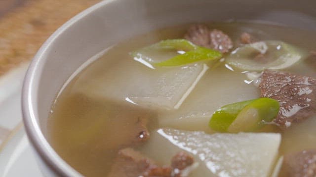 Warm bowl of steaming beef radish soup
