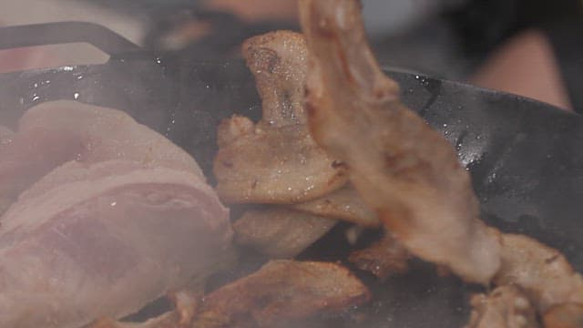 Grilling pork belly on a hot pan
