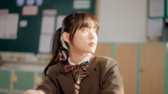 Student resting on a desk in a classroom