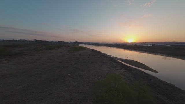 Sunset over a calm river landscape