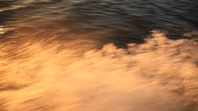 Glistening Water Waves at Sunset