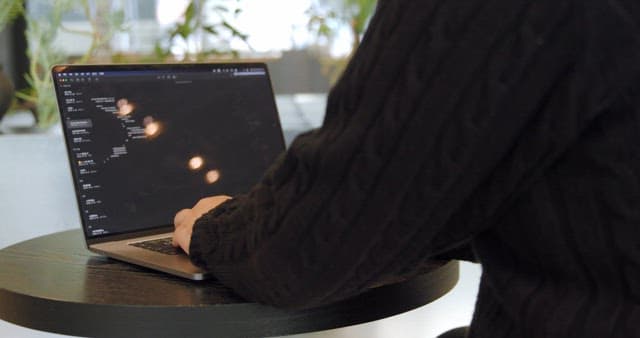 Person Working on Development with Laptop
