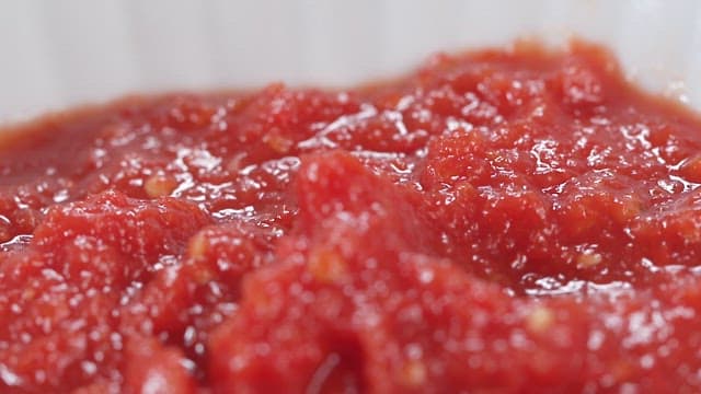 Detailed Texture of Crushed Tomatoes