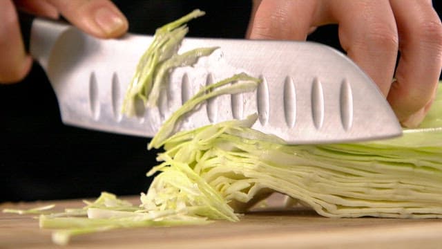 Slicing cabbage with a sharp knife