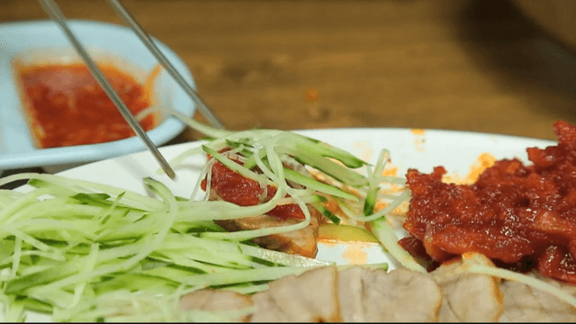 Sliced boiled pork with cucumber and sliced raw pollack salad