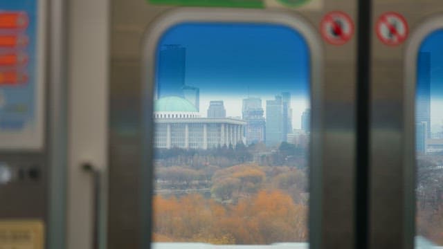 Cityscape view through a subway window