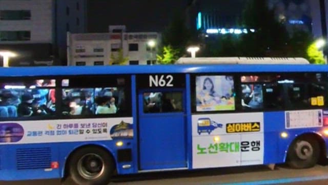 City Bus in Night Transit Filled with Passengers