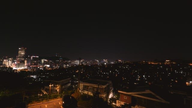 Busy cityscape at night seen from above