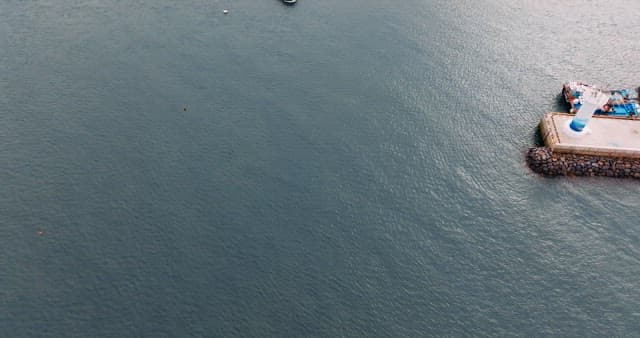 Boat Crossing the Calm Sea