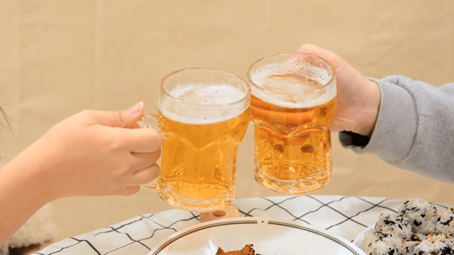 Friends Toasting With Beer