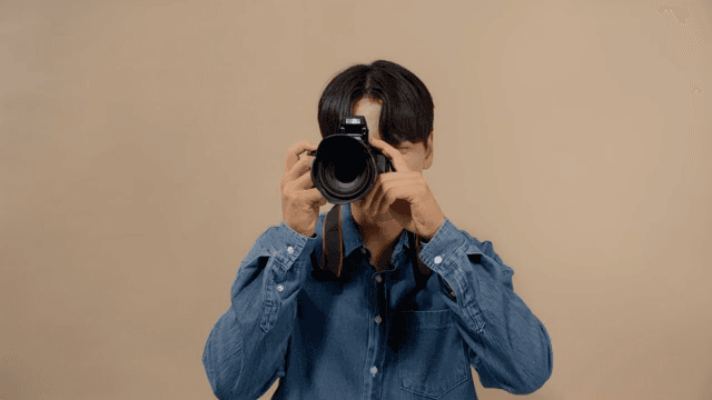 Man taking pictures with a DSLR camera