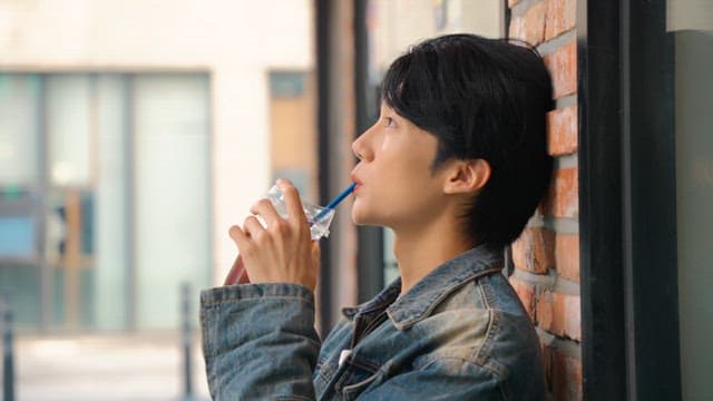 Young man relaxing and drinking coffee
