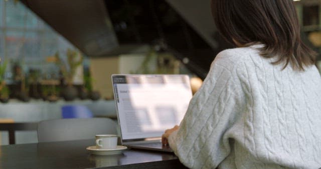 Taking a Sip of Coffee While Working