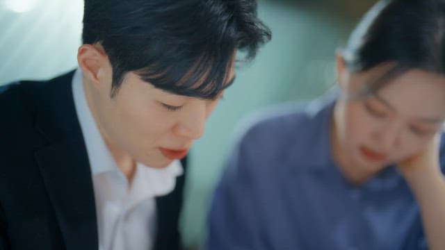 Two people focused on a discussion