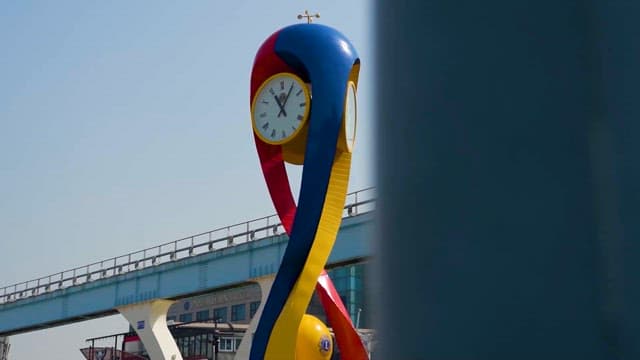 Colorful Sculptural Clock by the Roadside
