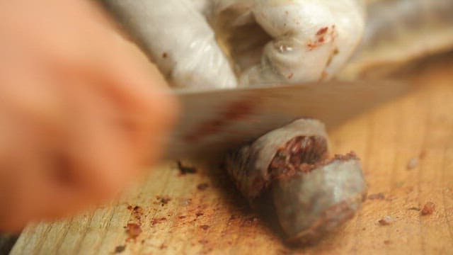 Sundae Being Cut on a Wooden Cutting Board