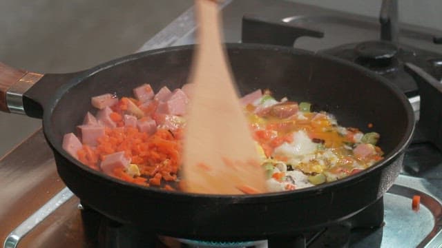 Cooking a Vibrant Vegetable and Ham Omelette