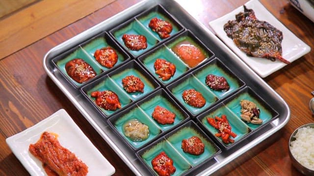 Various Korean salted seafood dishes on a table