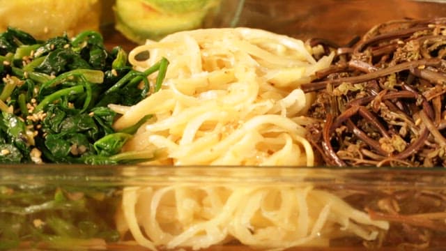 Various Korean Side Dishes for Holidays in Glass Bowls