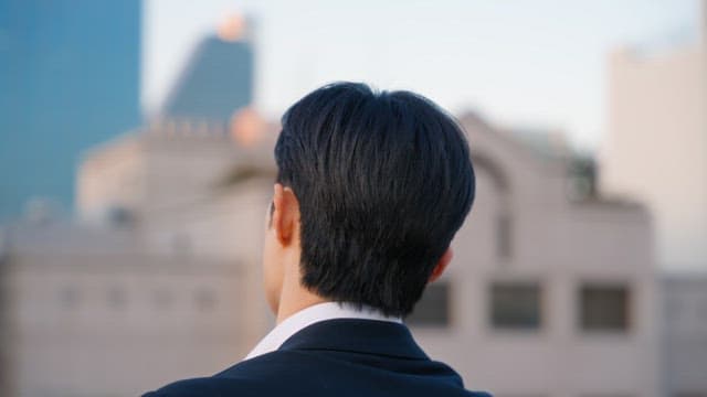 Man in a suit looking thoughtful