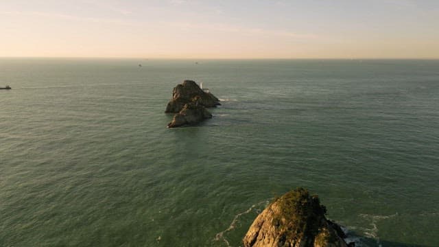 Rocky island surrounded by calm sea