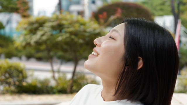 Woman enjoying a moment outdoors