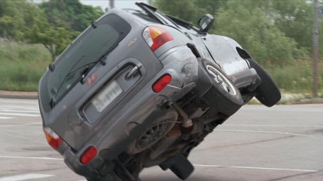 Car flipping over after an accident on the road