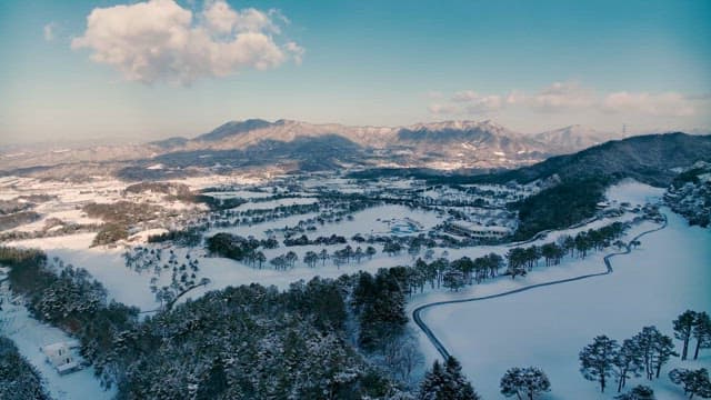Snowy Landscape and Winding Road