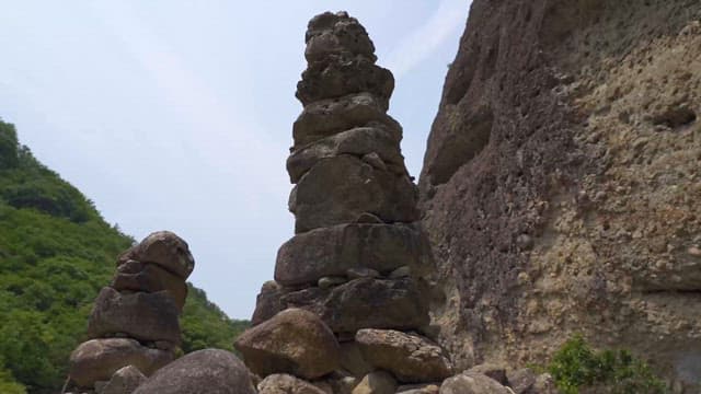 Stone Tower in Front of a Peaceful Temple